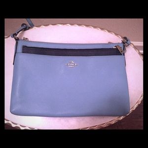 Coach Blue crossbody bag with detachable pouch.